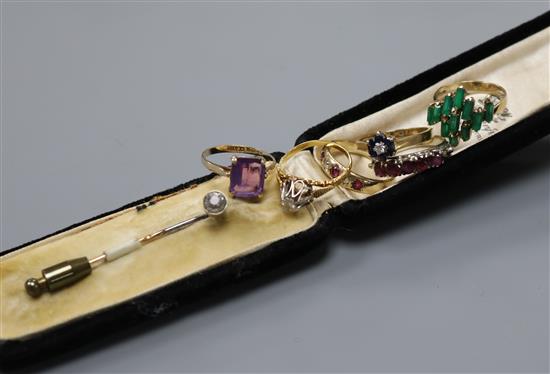 Four assorted 9ct gold and gem set rings, two 18ct gold rings and a paste set stick pin.